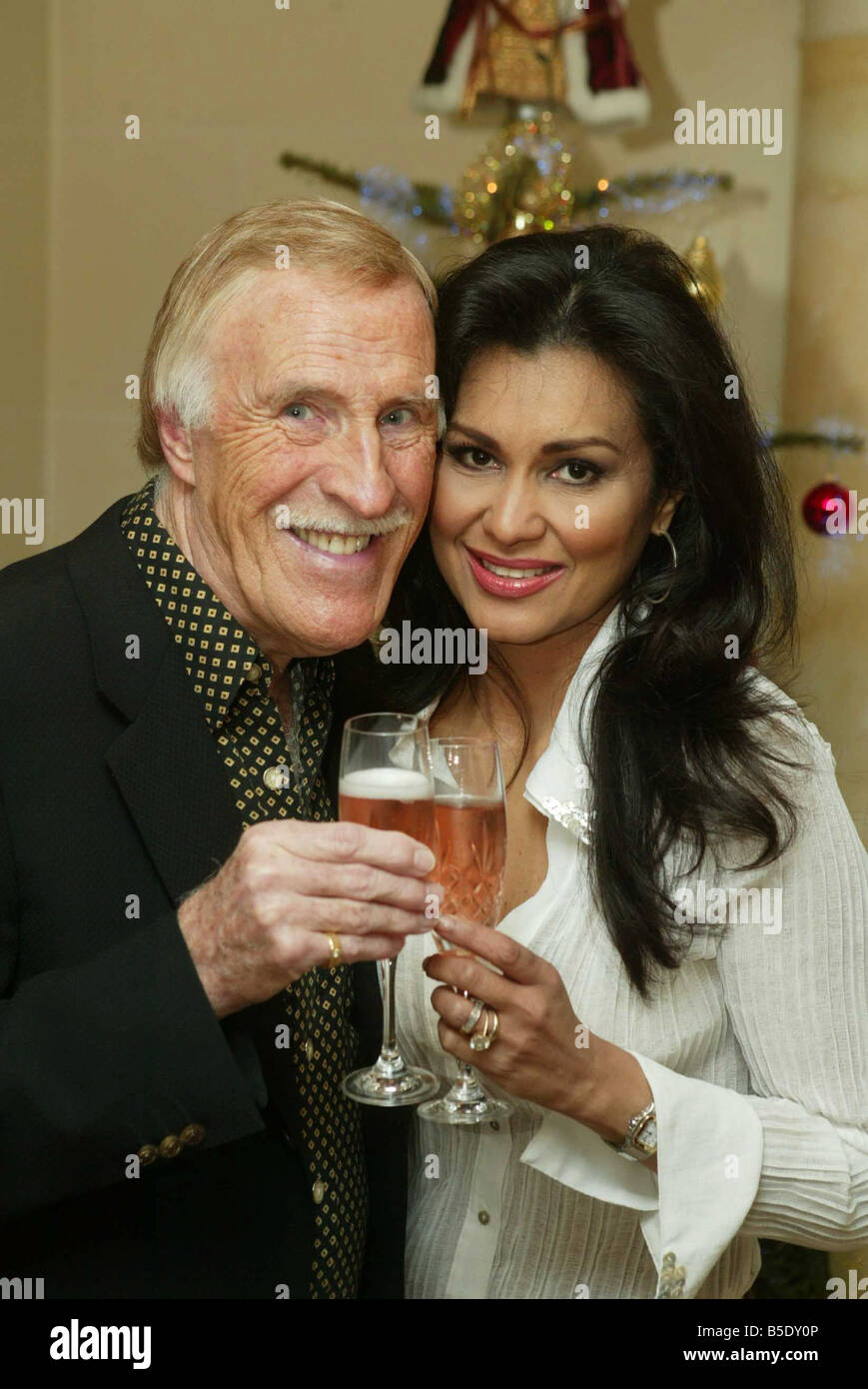 Televison presenter Bruce Forsyth with his wife Wilnelia at their home in Sunningdale after he recived the CBE December 2005 Stock Photo