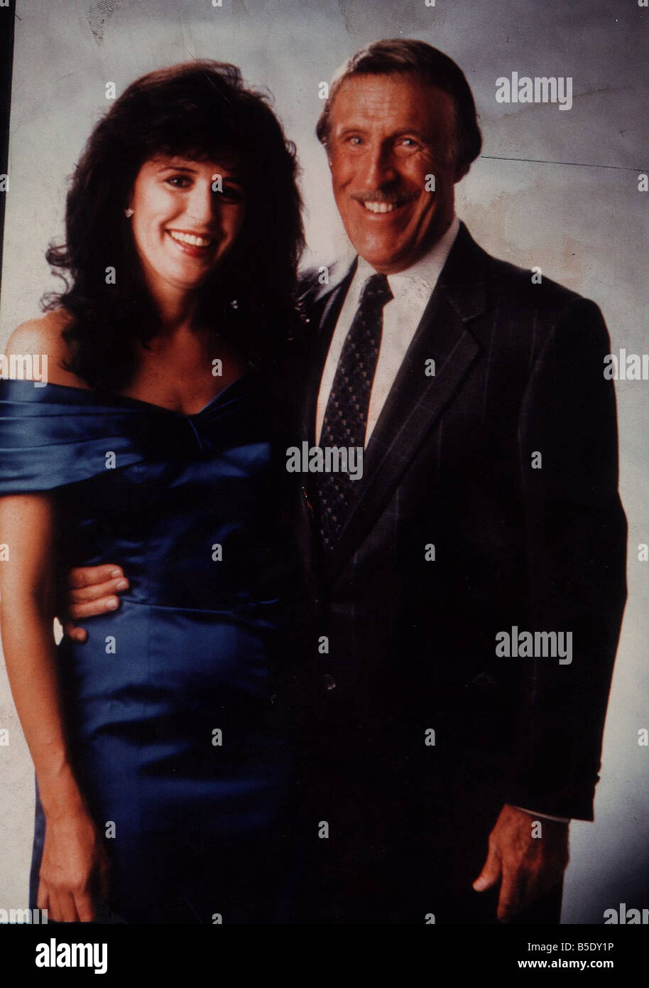 Rosemarie Ford blue dress gets a hug from Bruce Forsyth Stock Photo Alamy