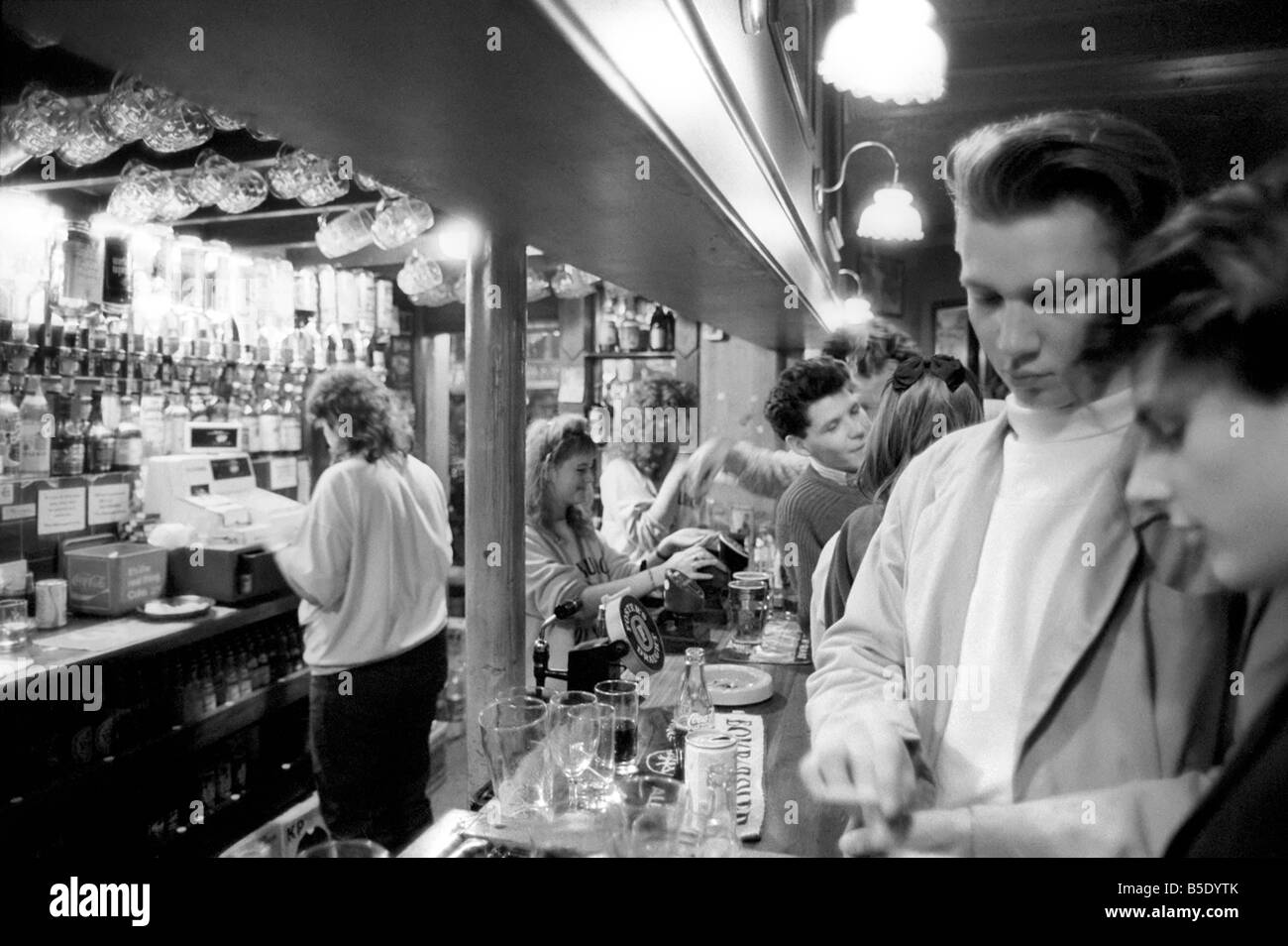 Drinkers in an East End Pub enjoying a pint of beer. March 1987 Stock