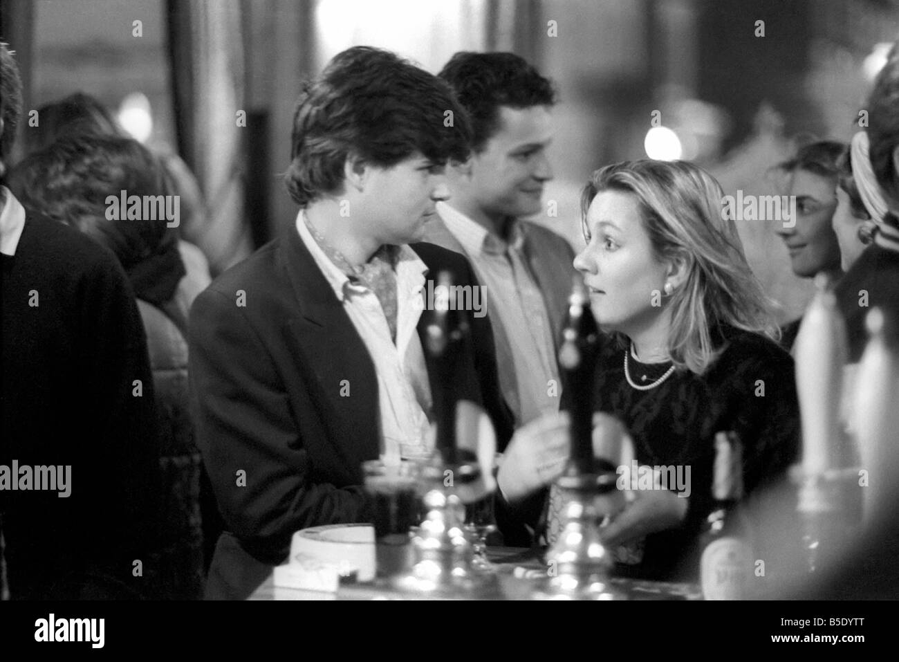 Drinkers in an East End Pub enjoying a pint of beer. March 1987 Stock Photo
