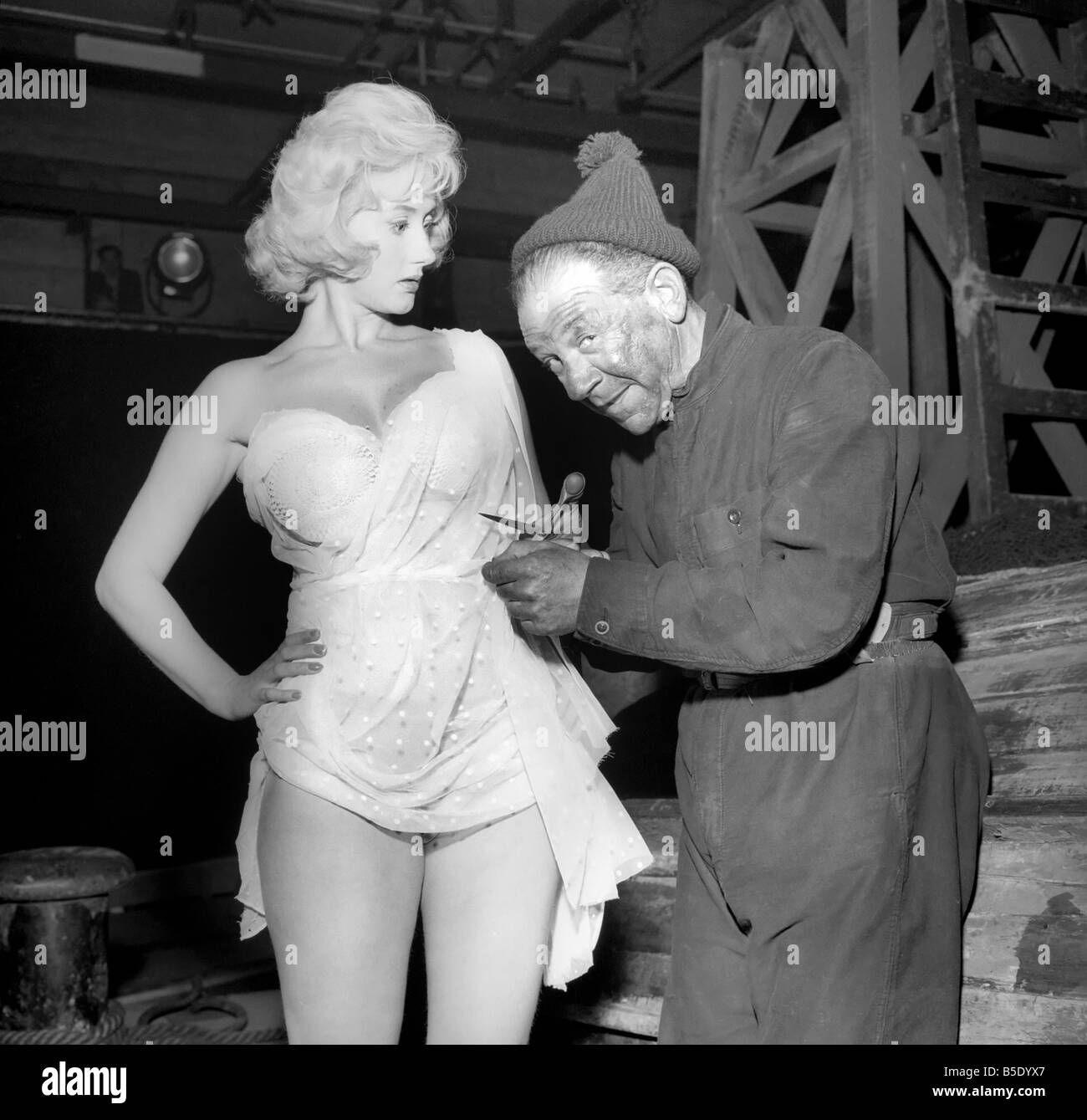 Actor Sidney James on set with Liz Fraser at Twickenham Studios were they are making 'Double Bunk'. October 1960 Stock Photo