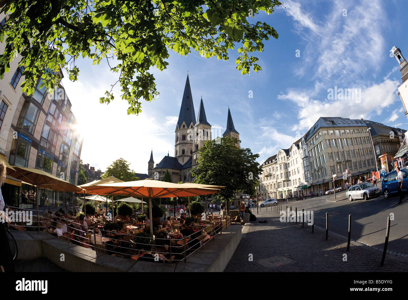 Germany, Bonn, Cathedral, sidewalkk cafe in foreground Stock Photo