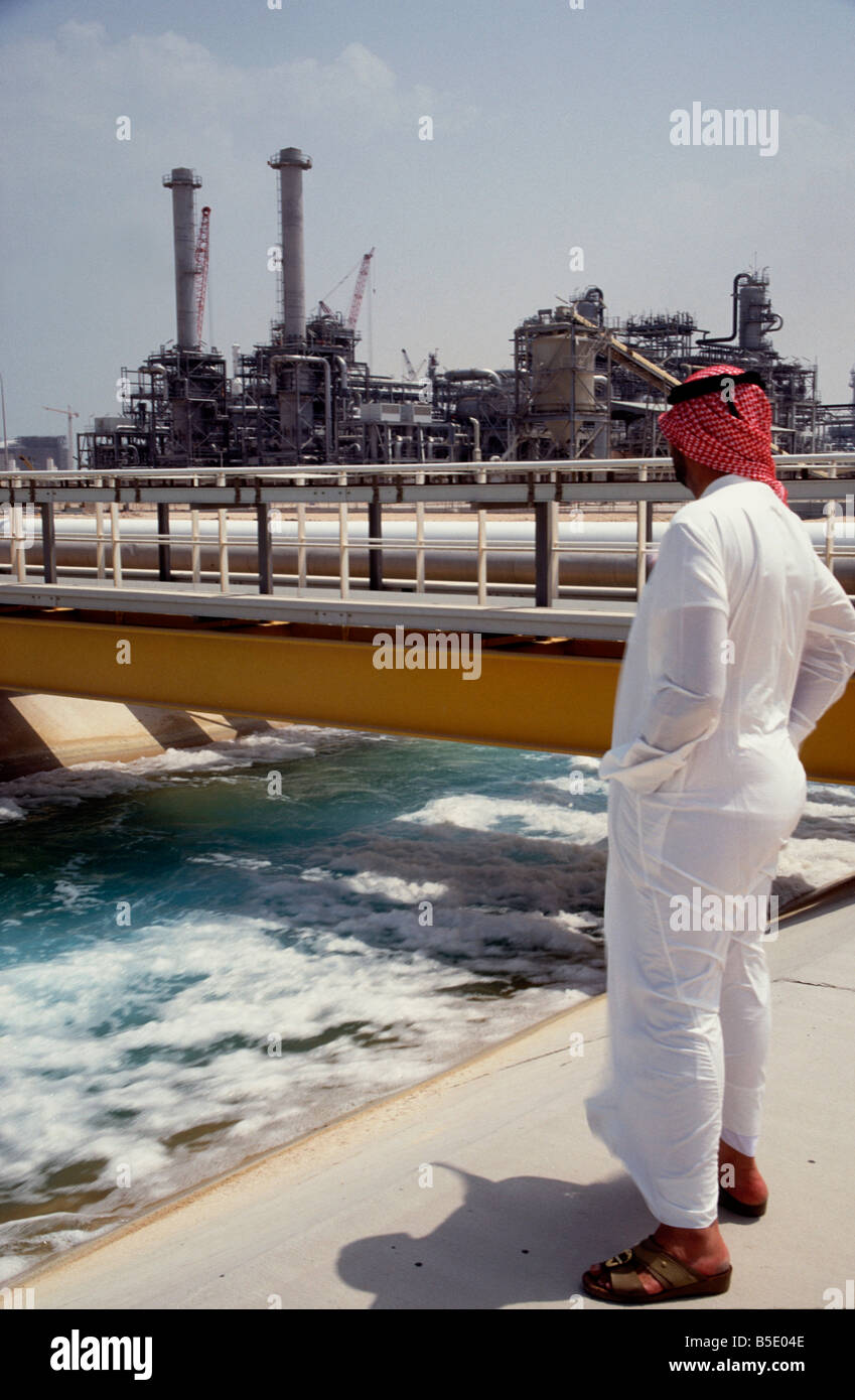 Arab man surveys ras lafan gas petrochemical plant qatar Stock Photo