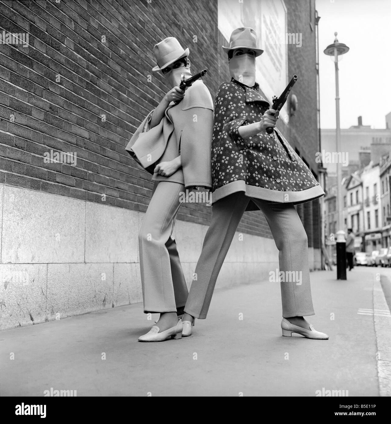 Stand and Delivery. Models seen here wearing a Rhona Roy capes and trouser suits with matching highwaymen masks in the streets in and around the Talk of the Town ftheatre. April 1967 X4004-007 Stock Photo