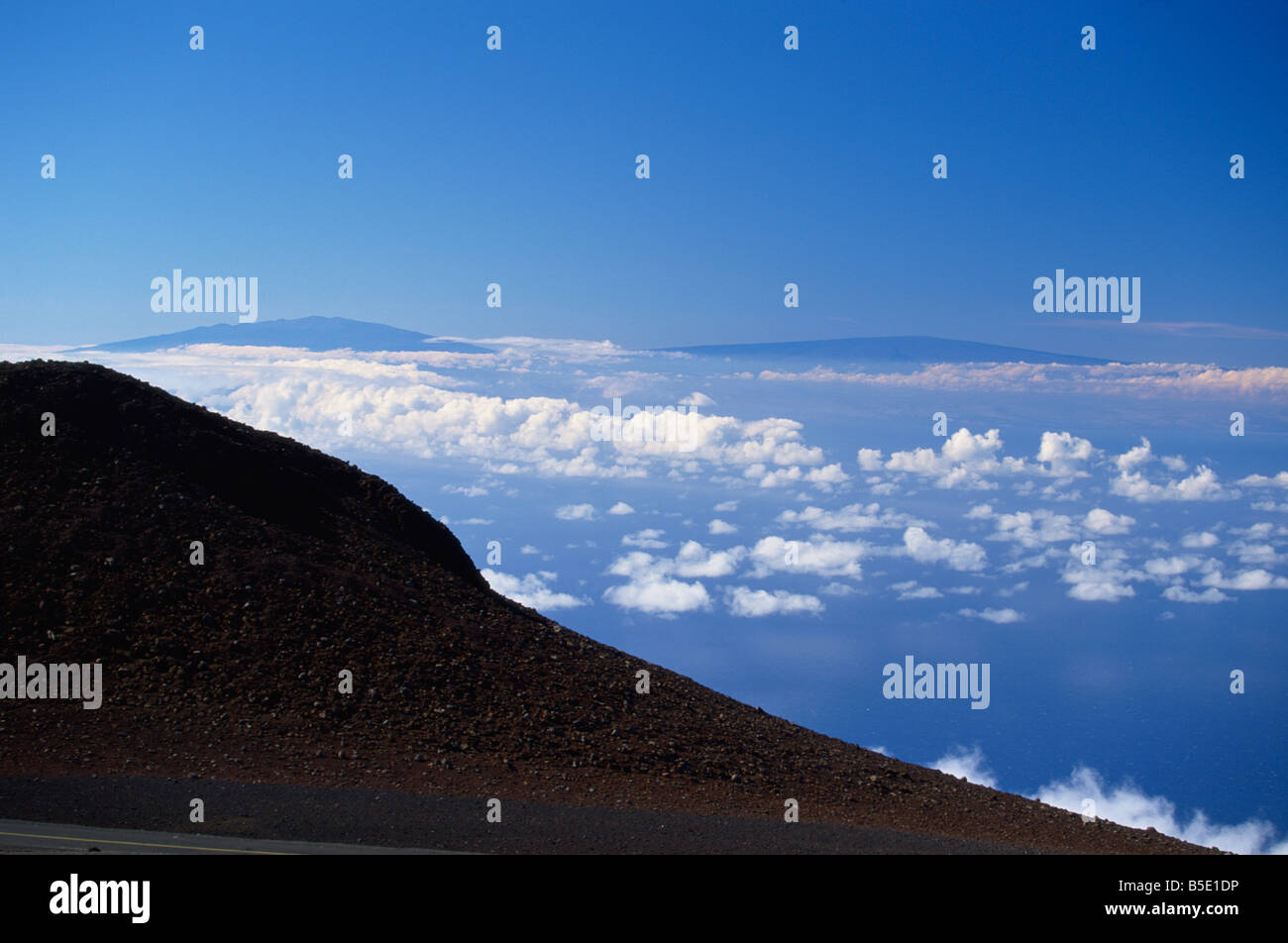 Two great volcanic peaks of Mauna Loa on right, and Mauna Kea on the