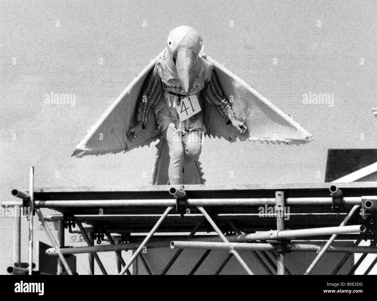 The Birdmen of Bognor marked the ninth anniversary of that momentous day when Bognor pier first hosted its now-famous birdman event. Witches, imitation airplanes, hang glidermen, fools and flights in fancy dress paraded before holiday makers at the West Sussex report before leaping off the and of the pier. The idea in to fly as far as possible and first prize of £250 went to Mike Collia, 51, who flew 22 metres on his hang glider. August 1980 P000984 Stock Photo