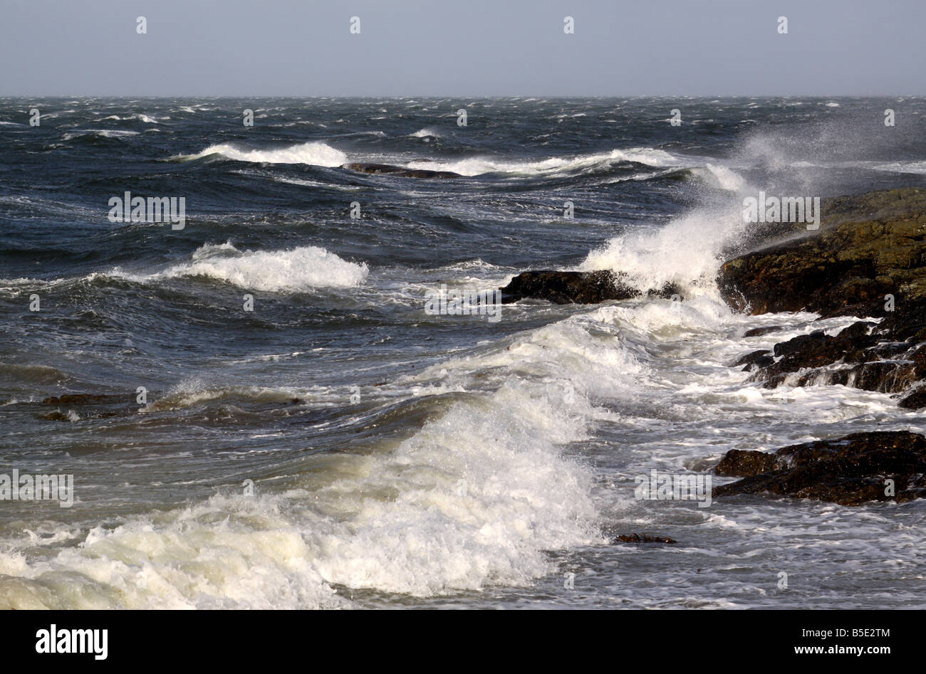 Waves breaking on rocks Stock Photo