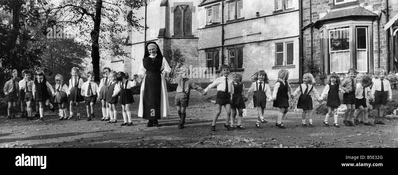 Sister David Power with her pupils at Holly Mount Convent at Tottington near Bury Lanes She has been there for fifty years teaching three and four year olds December 1970 Stock Photo