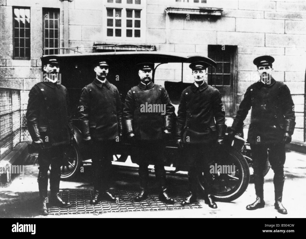 A group of mobile police officers with a police van 1910 1920 circa Stock Photo