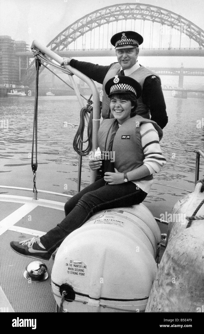 Teenager Debra Lawson with Constable Lyle Stout of Northumbria Police marine division during her day with the division Stock Photo