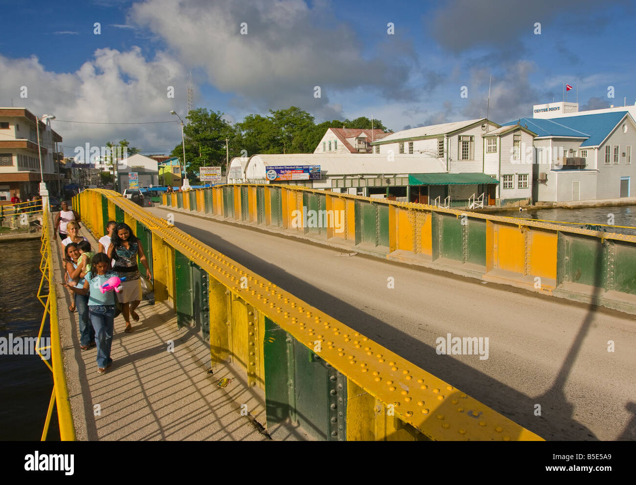 BELIZE CITY BELIZE People on the Swing Bridge which crosses Haulover Creek in downtown Belize City Stock Photo