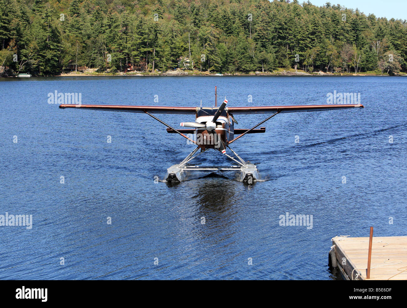A single engine float plane taxing