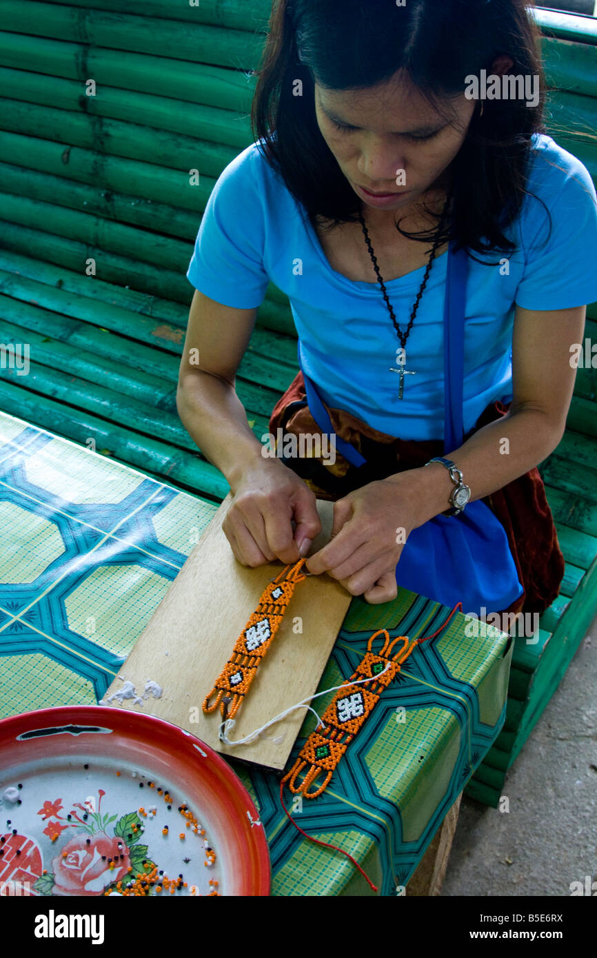 Woman Making Souvenir Handicrafts in Tana Toraja on Sulawesi in Indonesia Stock Photo