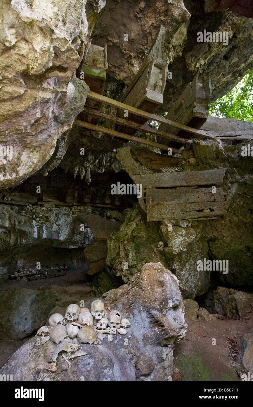 Skulls and Caskets Inside Cave Tombs at Tampangallo in Tana Toraja on Sulawesi in Indonesia Stock Photo