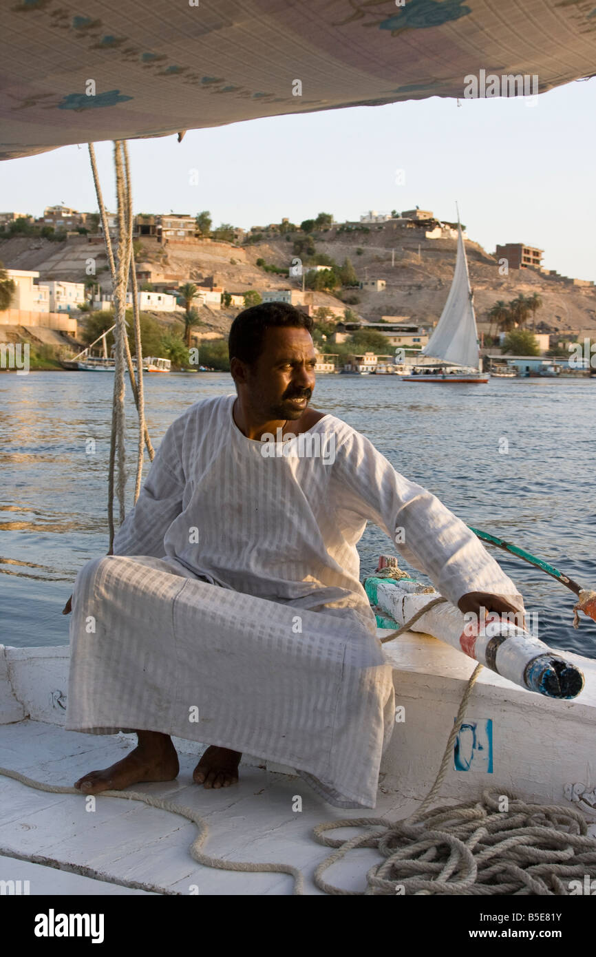 Captain of a Felucca on the Nile River in Aswan Egypt Stock Photo