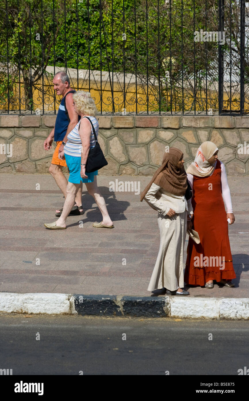 Tourists and Egyptian Muslim Women in Aswan Egypt Stock Photo