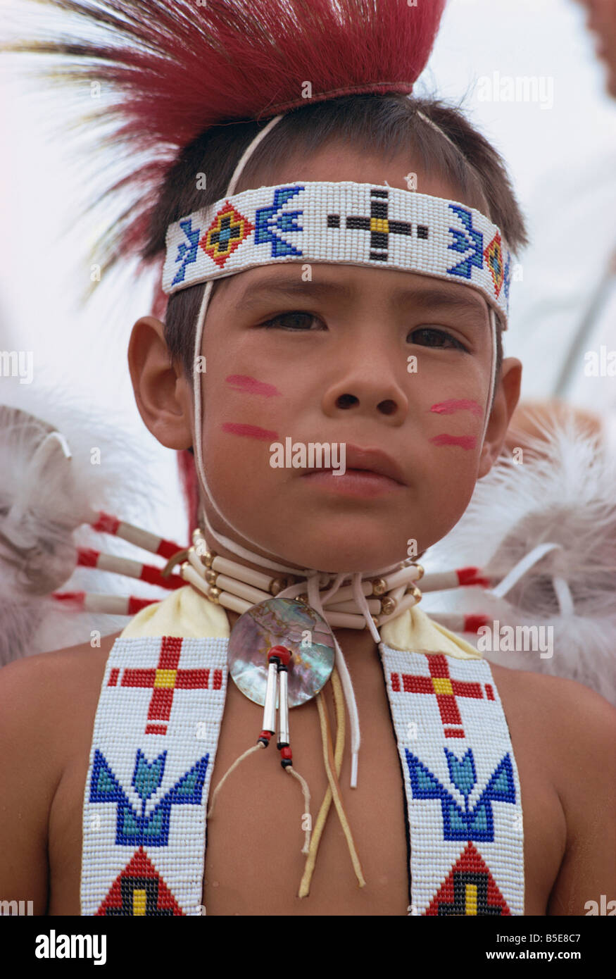 Portrait of young Crow indian boy in traditional costume, New Mexico