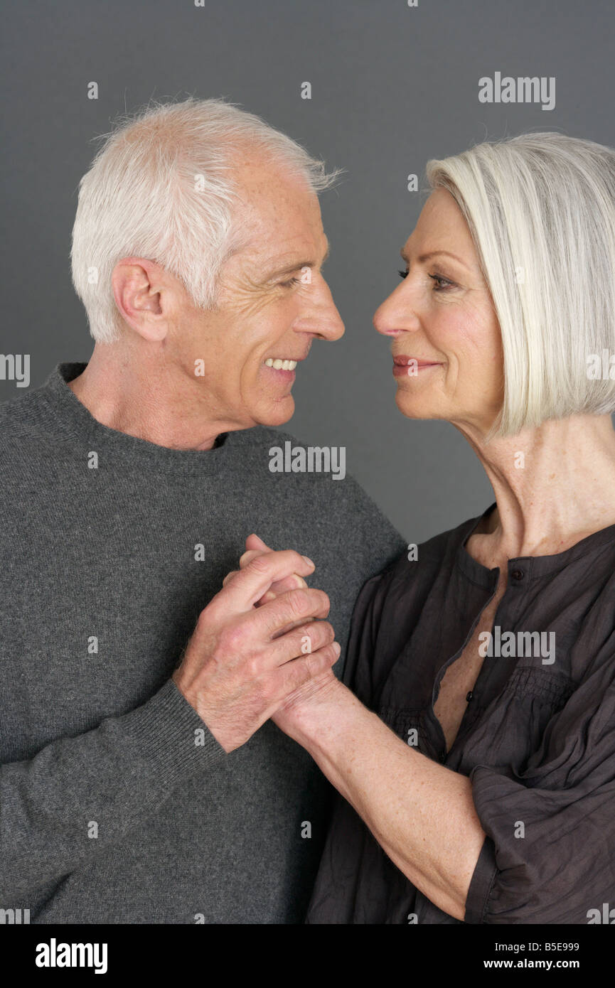 Senior man woman holding hands hi-res stock photography and images - Alamy