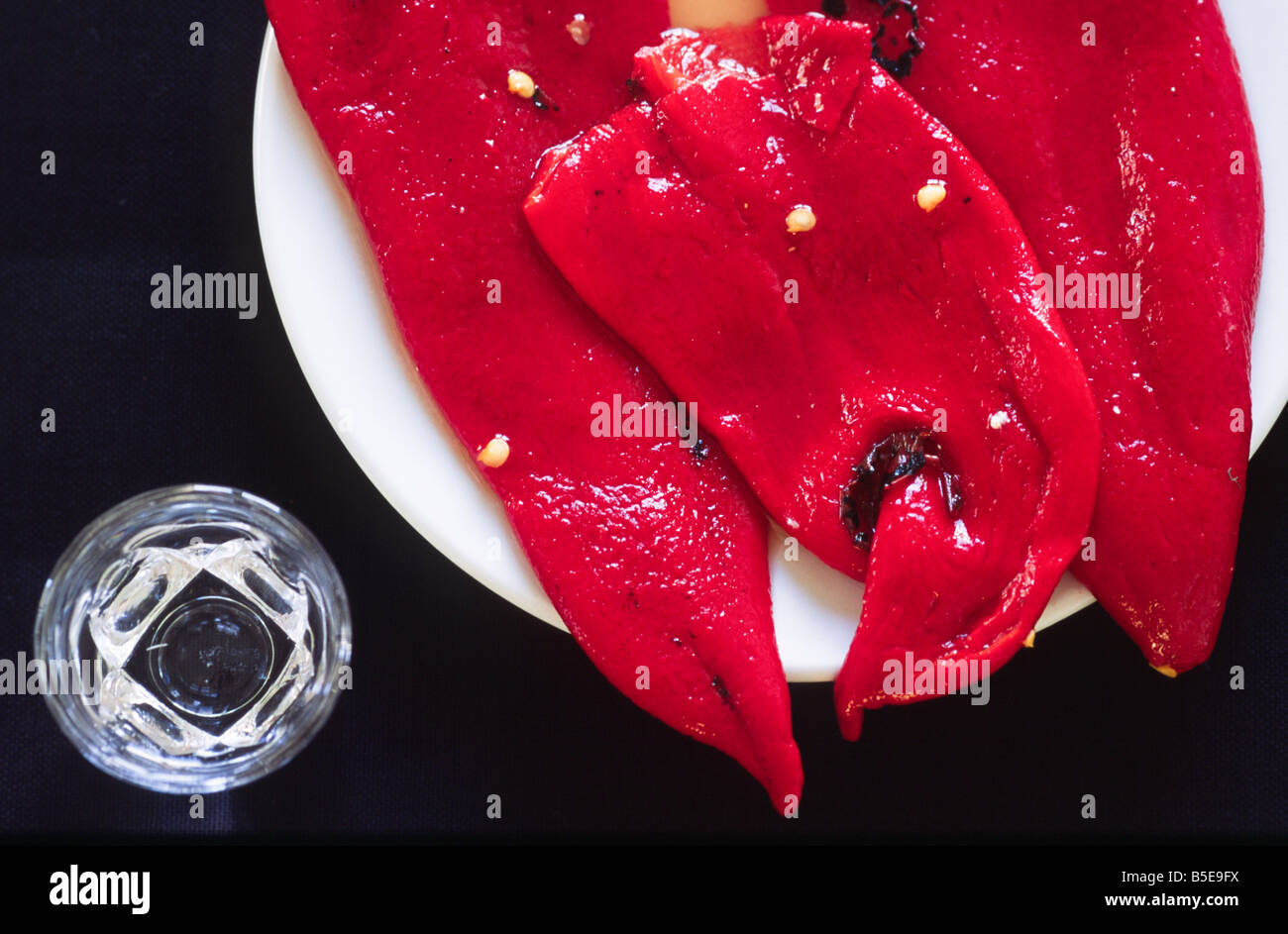 Red paprika as starter with a glas of ouzo (mezes tapa) Stock Photo