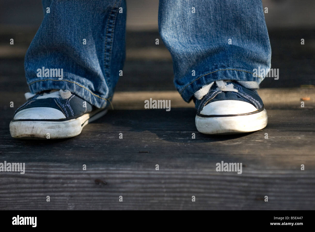 Boy's feet in tennis shoes. Sneakers. Stock Photo