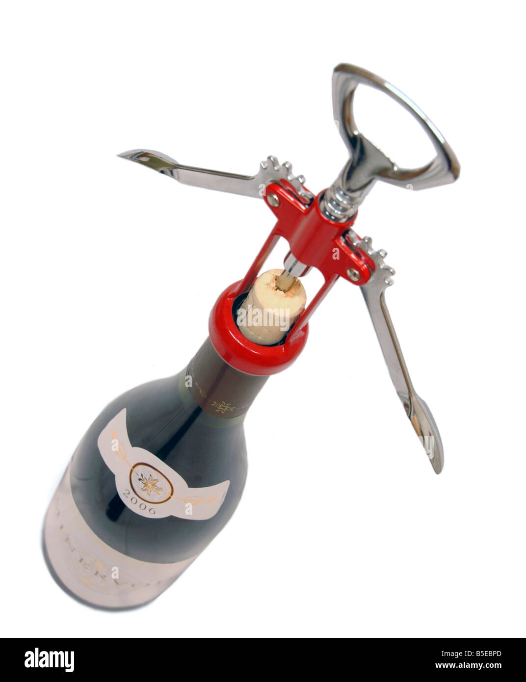 A cork screw opener half way through opening a bottle of wine. Stock Photo