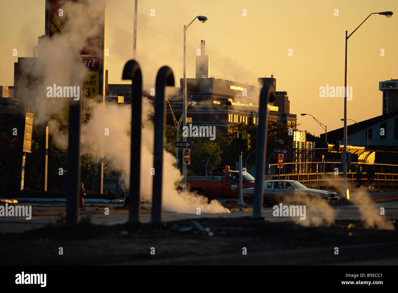 Steam escaping from below street at dusk, Hamtramck, a Polish inner city area, Detroit, Michigan, USA, North America Stock Photo