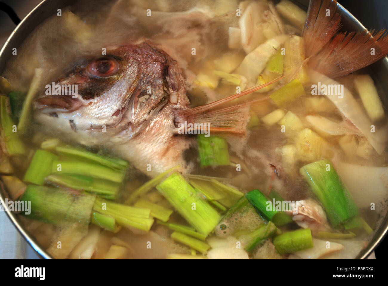 The typical Vietnamese sour fish head soup ( canh chua dau ca ) Stock Photo