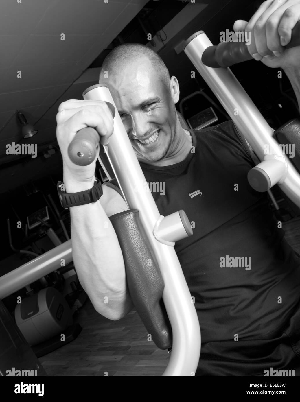 Man Using Strength Muscle strength studio sport Black and White Stock Photos & Images - Alamy
