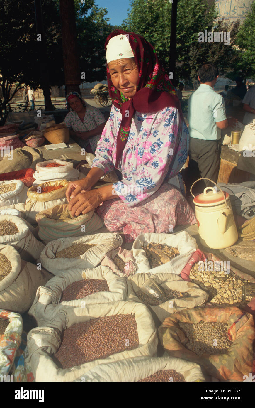 Herb seller in main food market, Samarkand, Uzbekistan, Central Asia Stock Photo