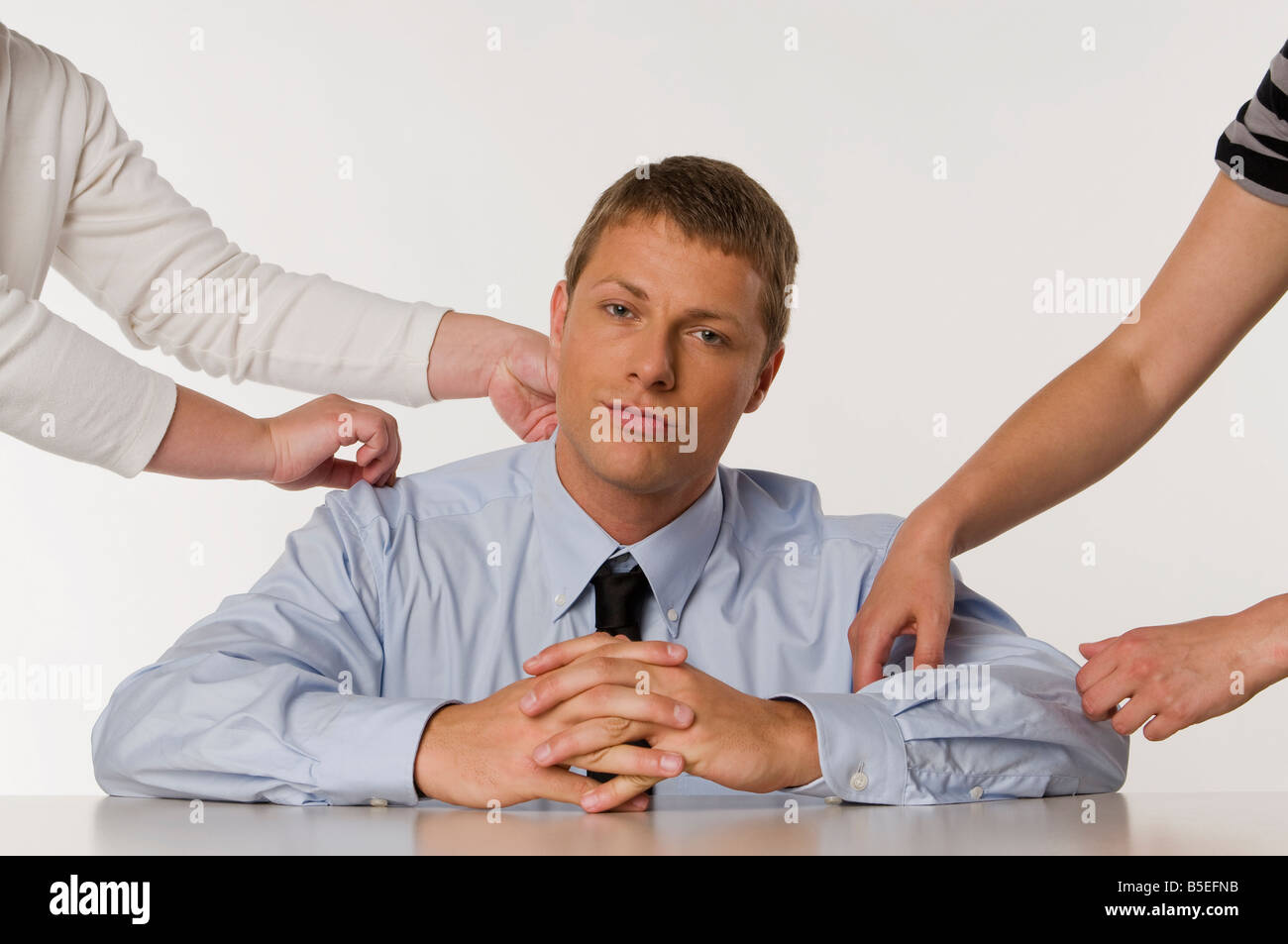 Man sitting hand folding hi-res stock photography and images - Alamy
