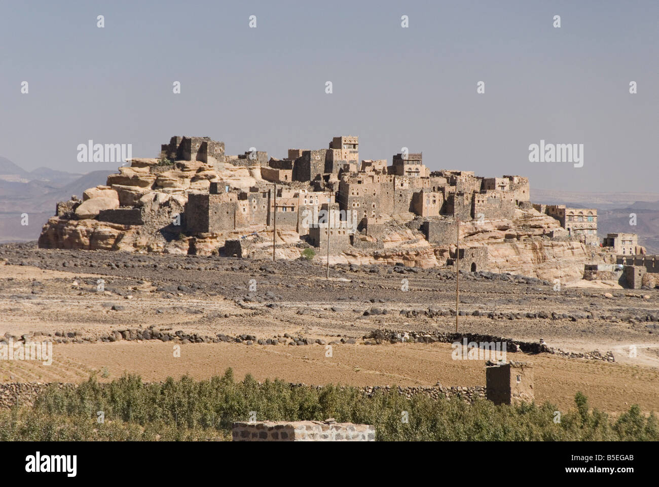 Old village built on sandstone crag Al Gorza Shibam valley near San a Yemen Middle East Stock Photo