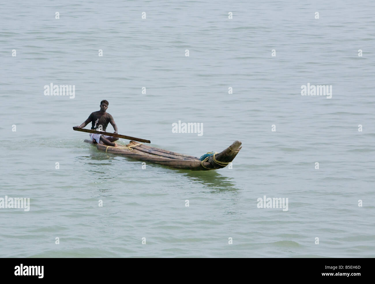 indian fisherman in simple canoe Stock Photo Alamy