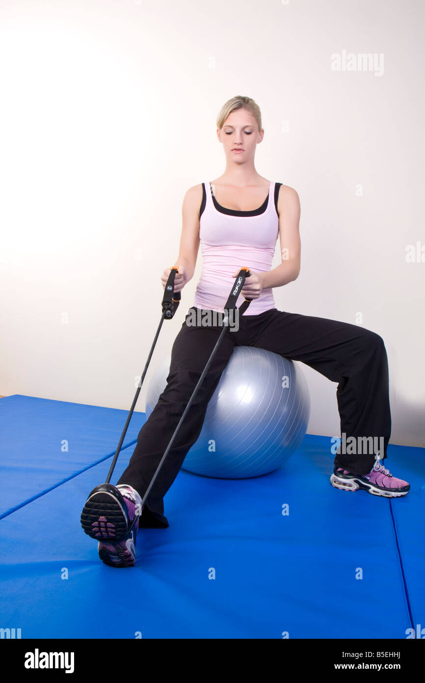 young woman doing fitness exercise on Swiss ball Stock Photo - Alamy