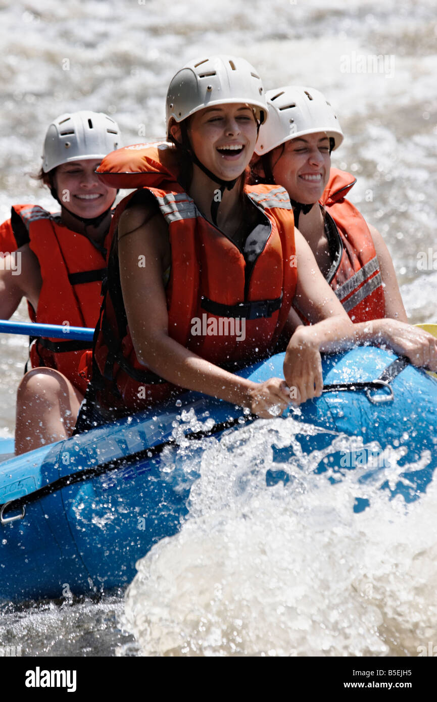 Girls laughing as they raft down the Ocoee River in East Tennessee Stock Photo