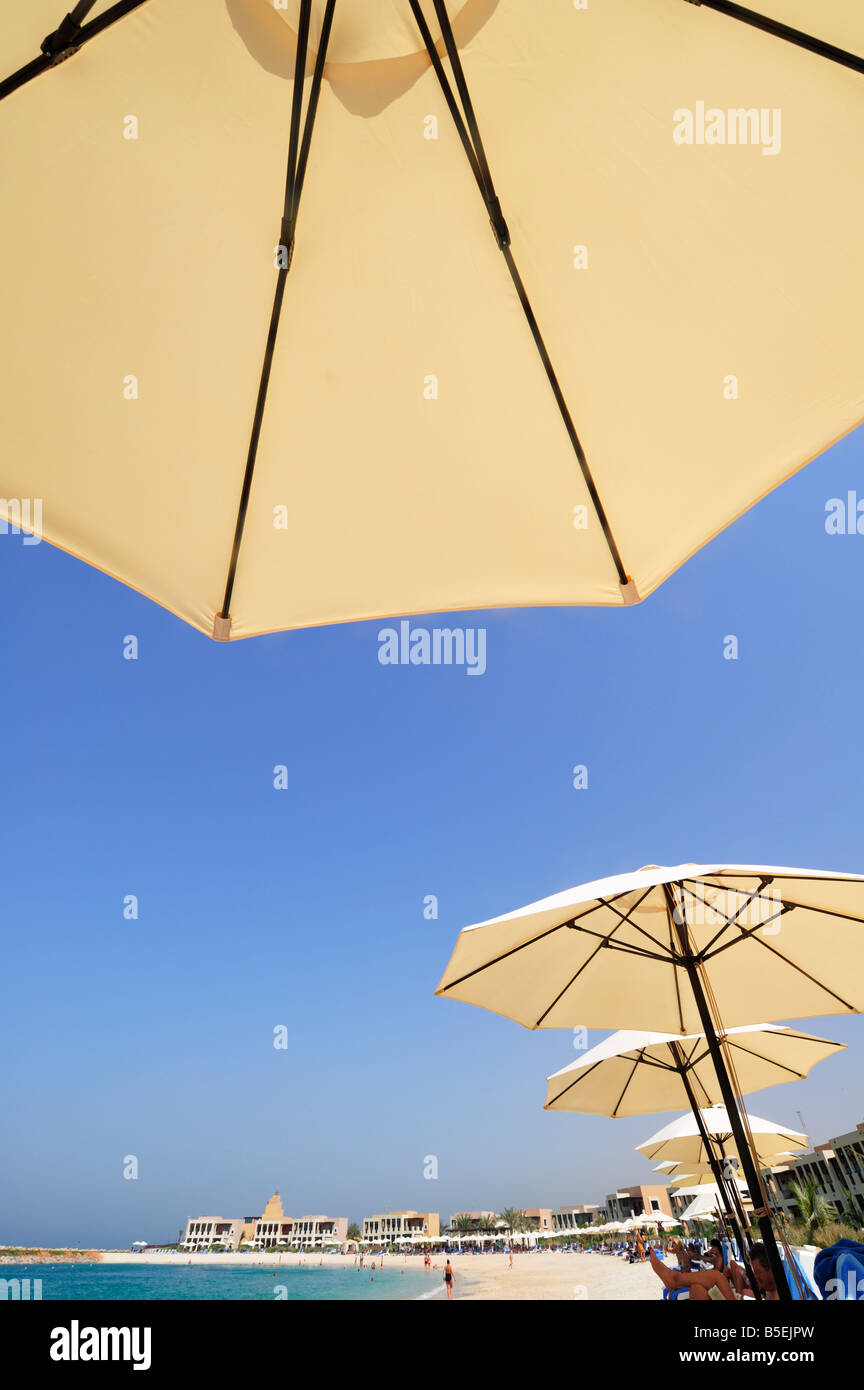 Private Hotel Beach and Parasols at the Waterfront,  Ras Al Khaimah Stock Photo