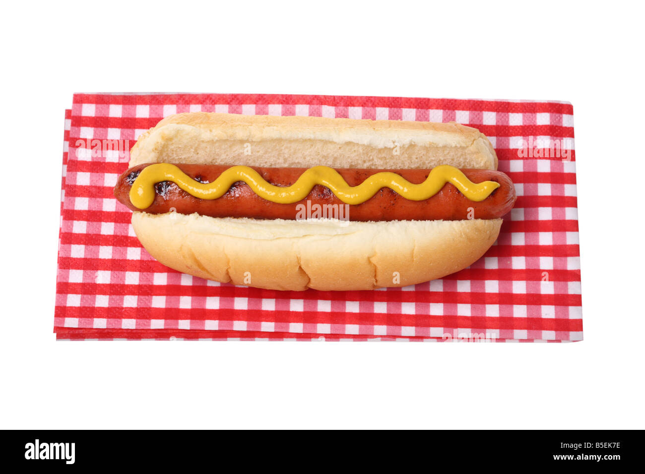 Hot dog on napkin cutout on white background Stock Photo