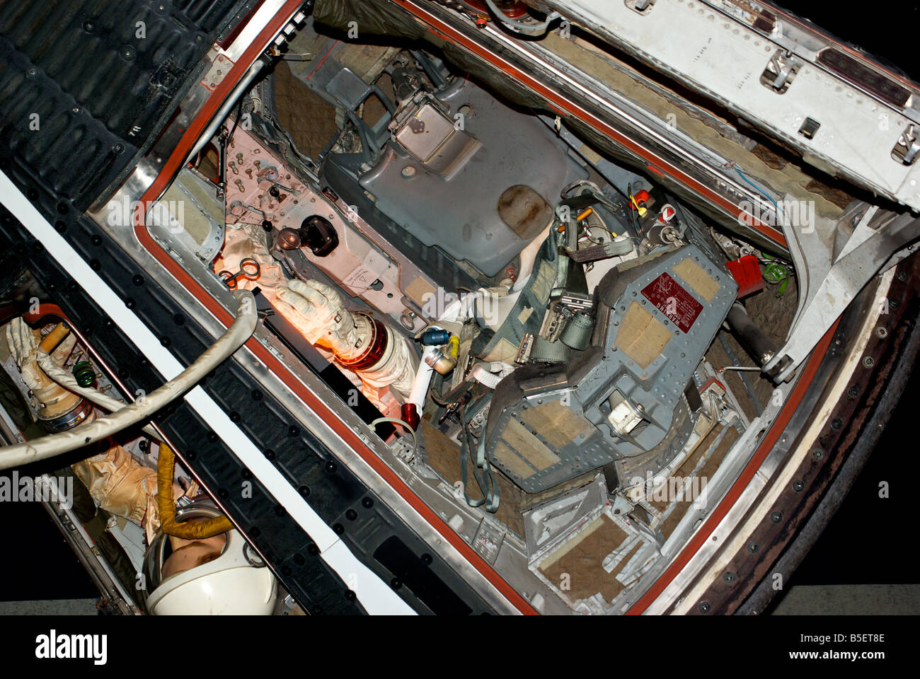 Tight confines for an astronaut in the mockup display of an space capsule from early space missions Stock Photo
