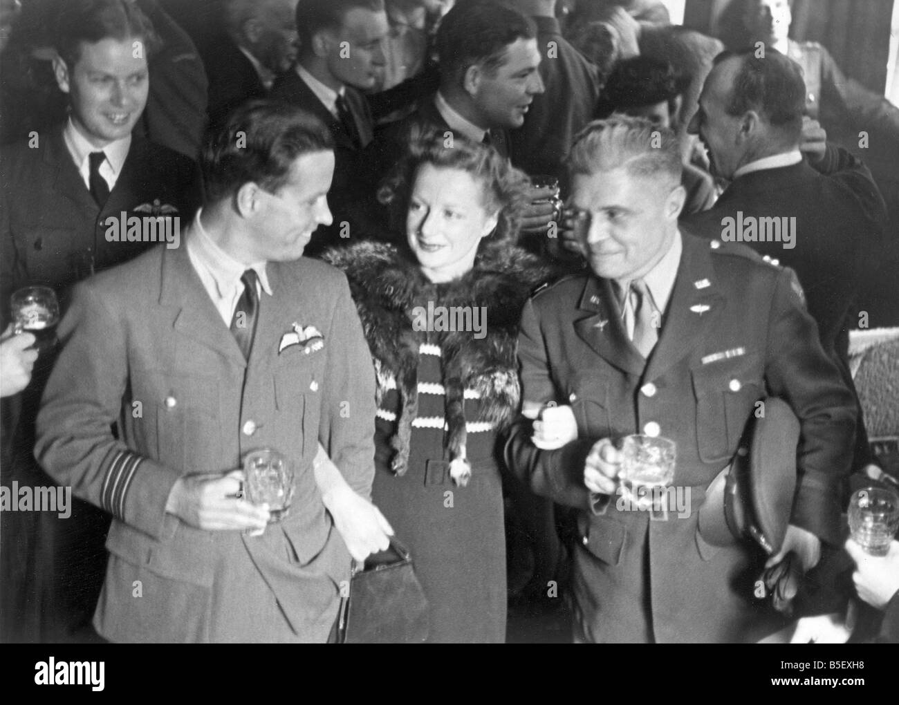 Dam Busters.Wing Commander Guy Gibson and Mrs Gibson talking with Captain W.K Clark, U.S Army after the investiture. June 24th 1 Stock Photo