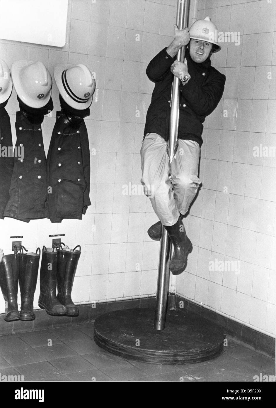 Firefighter Geoff Kelly slides down the pole at Consett Fire Station