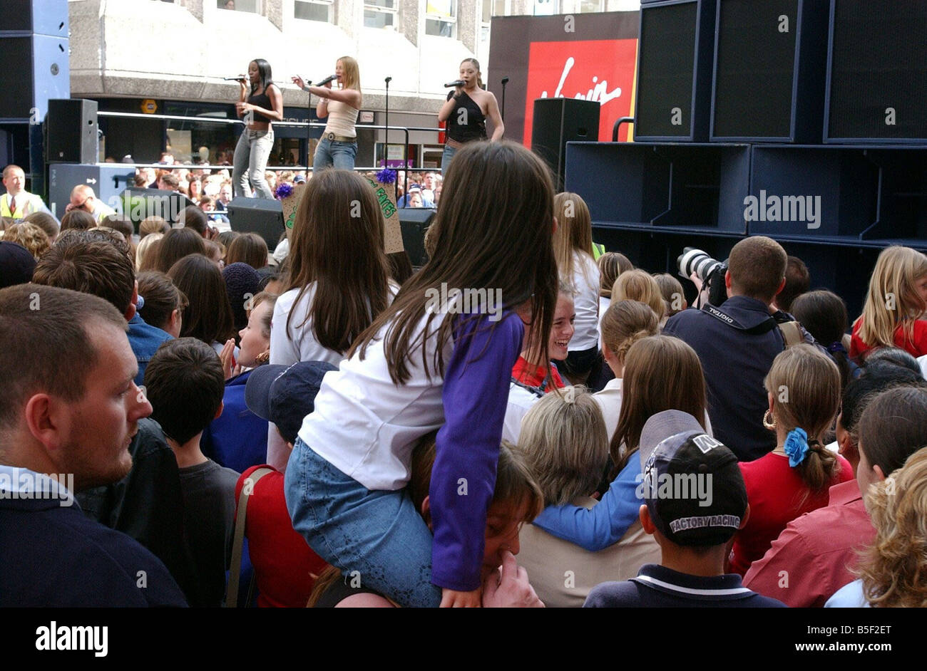 Crowds flood Northumberland Street Newcastle to watch the Sugababes perform before they started their signing session at Virgin Stock Photo
