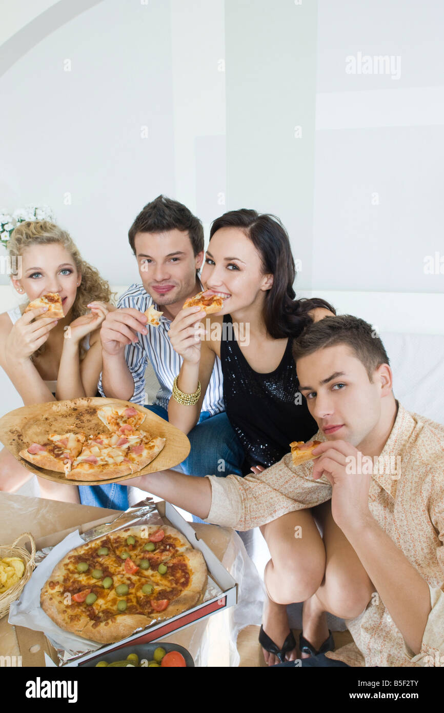 friends eating pizza Stock Photo