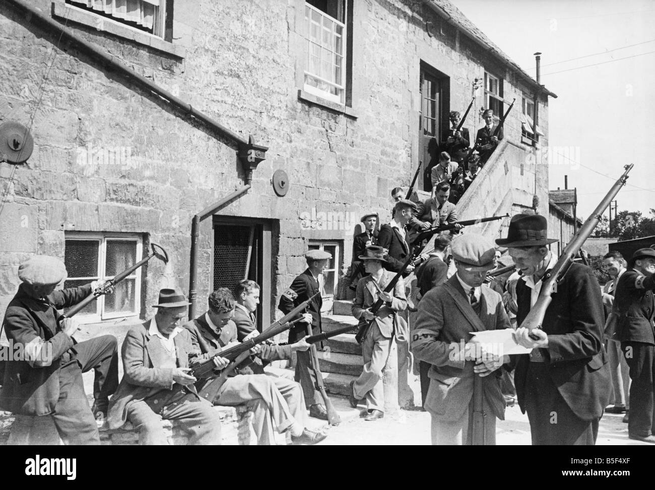 Defence of the Homeland. Parashooters aged 17-72 meet in the ancient market hall to organise which parts of the countryside they will be covering as look-outs.;3rd July 1940. Stock Photo