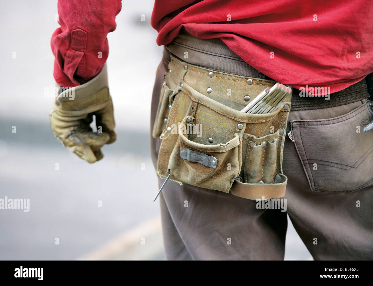 Construction worker wearing tool belt Stock Photo Alamy