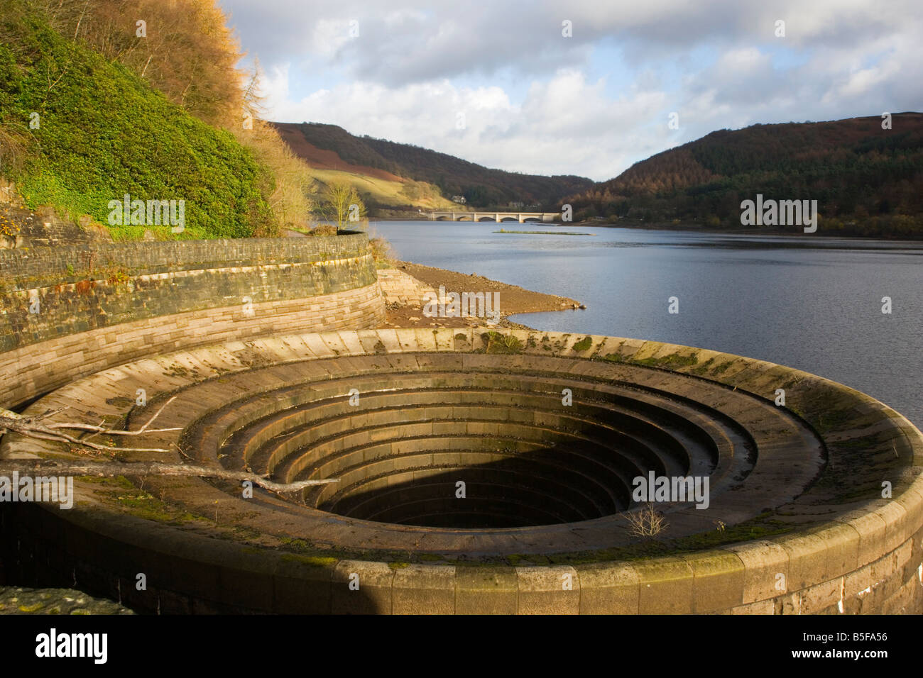 View of the Overflow at Ladybower Reservoir with Ashopton Viaduct in the background in the Peak District in Derbyshire Stock Photo