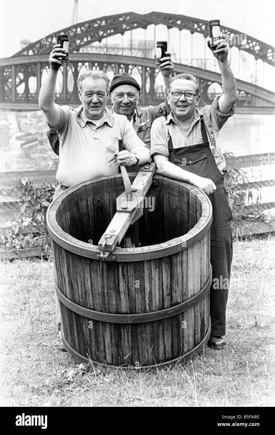 Coopers Paddy McGeever left and Jacky Webster right and fitter bobby Adamson celebrate the completion of their dolly tub which will go on show in a County Durham mining museum Stock Photo