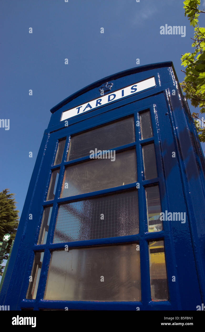 An old english telephone booth painted blue as a tardis Stock Photo