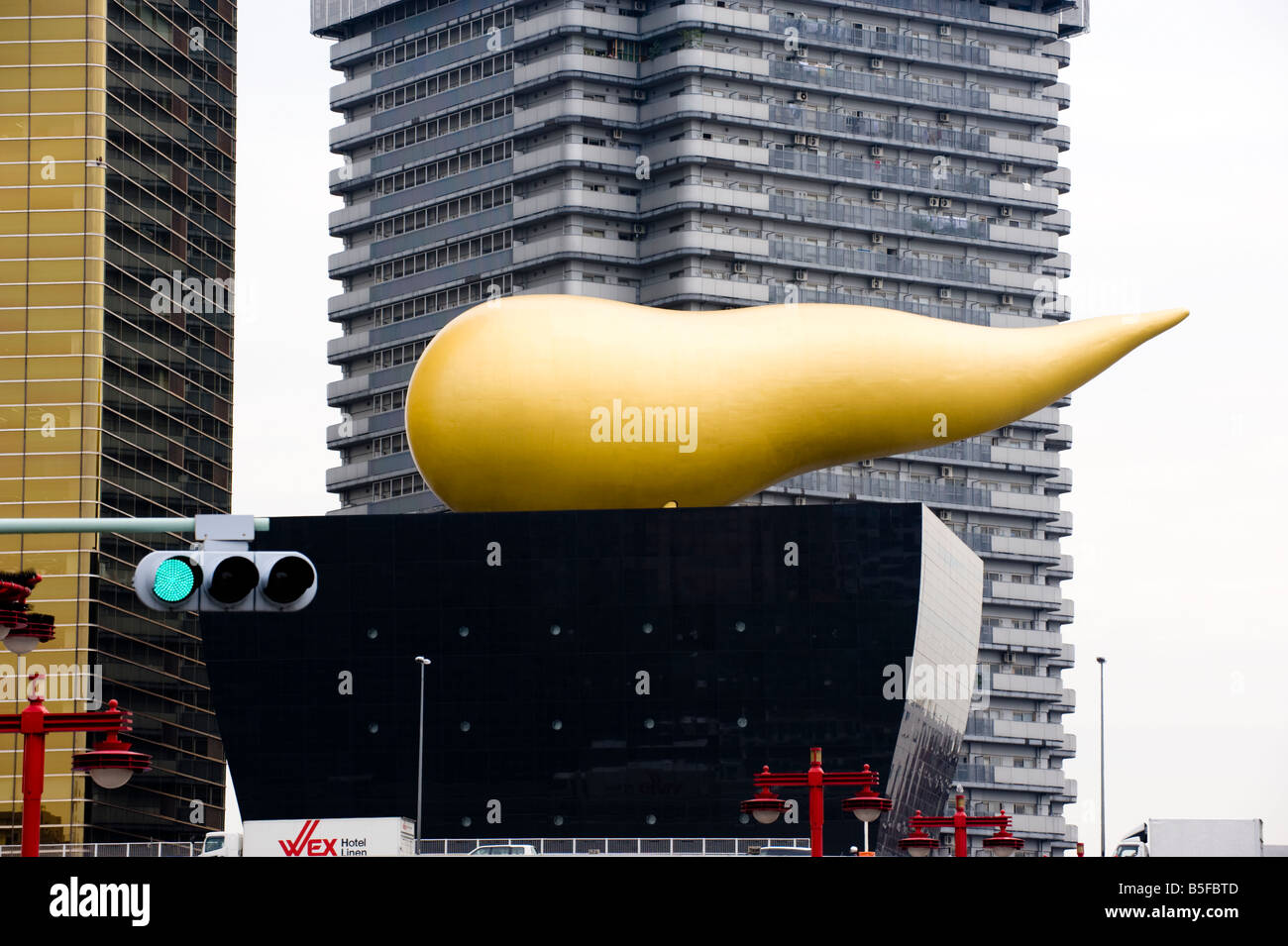 Golden flame sculpture by French designer Philippe Starck on the