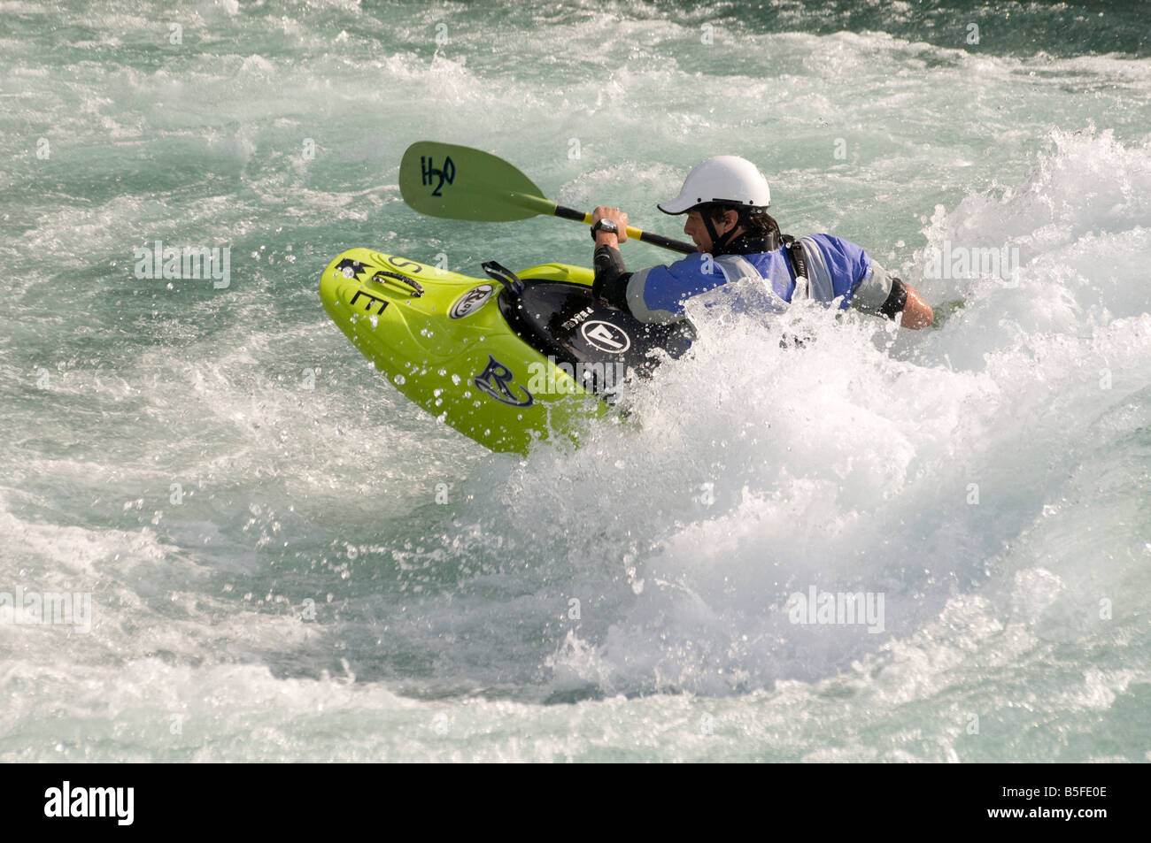 Competitor in whitewater kayaking competition Stock Photo Alamy