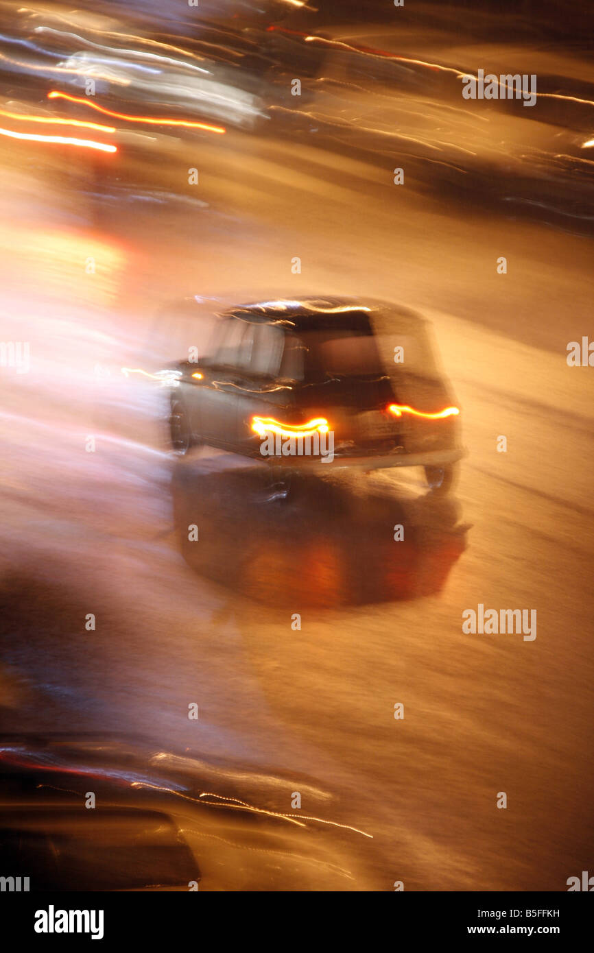 fast car driving in heavy rain at night in town Stock Photo - Alamy