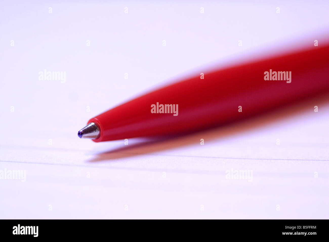 Red biro pen on paper close up Stock Photo Alamy